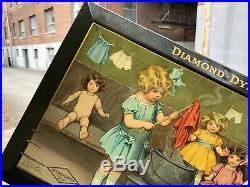 VINTAGE RARE CRISP c. 1900 DIAMOND DYES A BUSY DAY IN DOLLVILLE TOC SIGN