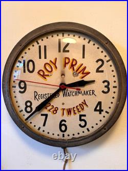 Vintage Advertising Wall Clock ROY PRIM Registered Watchmaker 3228 Tweedy