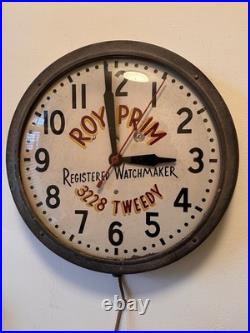 Vintage Advertising Wall Clock ROY PRIM Registered Watchmaker 3228 Tweedy
