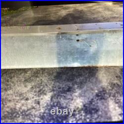 Vintage Allstate Light Up Can Sign Hung On Side Of Building