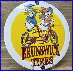 Vintage Brunswick Tires Porcelain Sign Gas Station Disney Donald Duck Bicycle
