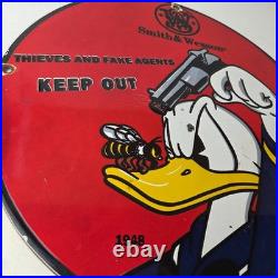 Vintage Smith & Wesson Porcelain Sign Donald Duck Ad Gas Pump Firearms Sign