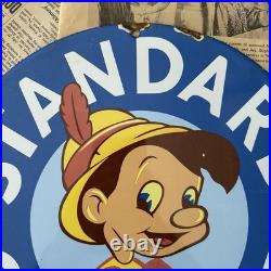 Vintage Standard Gasoline Pinocchio Walt Disney 12 Inch Porcelain Enamel Sign