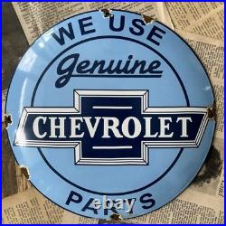 Vintage We Use Genuine Chevrolet Parts 12 Inch Convex Porcelain Enamel Sign