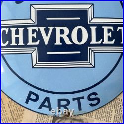 Vintage We Use Genuine Chevrolet Parts 12 Inch Convex Porcelain Enamel Sign