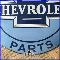 Vintage We Use Genuine Chevrolet Parts 12 Inch Convex Porcelain Enamel Sign
