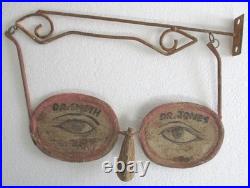 Vintage old Optometrist's advertisement / trade sign specs with wall bracket